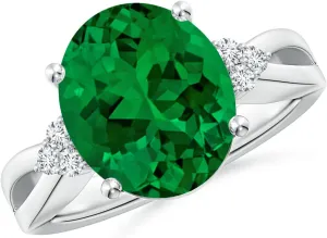 Angara Solitaire Oval Lab Grown Emerald Split Shank Engagement Ring with Trio Diamonds in Silver / 14K Solid Gold/Platinum | Birthday, Anniversary, Wedding Jewelry Gift for Women