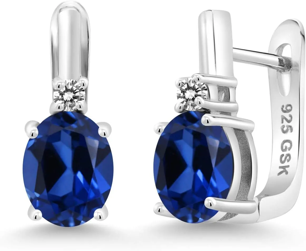 Gem Stone King 925 Sterling Silver Blue Created Sapphire and White Diamond Earrings For Women (4.73 Cttw, Gemstone September Birthstone, Oval 9X7MM)